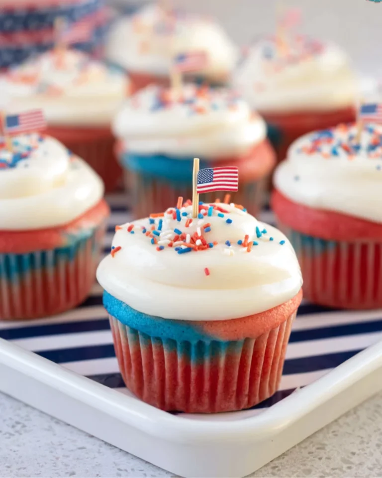 Red White and Blue Cupcakes served on patriotic tray with mini flags